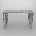 Intricately Carved Metal Coffee Table With Ornate Legs And Decorative Top Surface