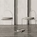 Modern Transparent Frame Leisure Chairs With Gray Cushion On Gray Floor Against Light Colored Wall
