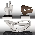 Contemporary Artistic Sculptures Featuring Various Curved Metallic Lines And Shapes
