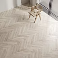 Herringbone Wooden Flooring in Various Tones for Interior Room with Chair