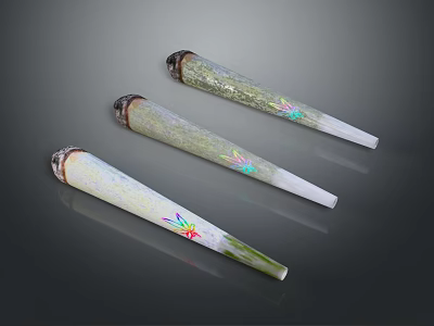 Three Conical Decorative Items With Green White Surface And Colorful Patterns 3d model