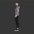 Man in Gray Hoodie Black Pants and Black White Sneakers with Glasses on Gray Background