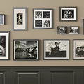 Wall Decor With Multiple Size Frames Displaying Black White Photos And Scenery