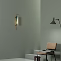 Modern Minimalist Leisure Chair With Beige Cushion Black Frame Light Green Wall And Lamps