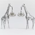 Decorative Chandeliers Suspended From Silver Textured Giraffe Sculptures In Modern Decor Design