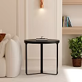 Modern Beige Sofa With Black Round Coffee Table And Brown Cushion Green Plant Wooden Shelf