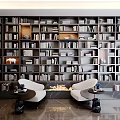 Floor To Ceiling Bookshelf Filled With Books And Cozy Seats In Modern Home Library