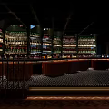 Modern Bar Interior Design Featuring Tall Wine Racks And Curved Bar Counter Lighting