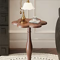 Elegant Wooden Side Table With Petal Shaped Top Gold Lamp Books And Small Cup