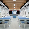 Modern Bright Spacious Laboratory Featuring White Lab Benches Blue Countertops Hanging Instruments Chemical Molecule Posters