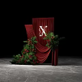 Floral Installation with Red Curtain White X Red Berries Green Foliage and White Wedding Dress