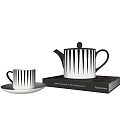 Modern Black And White Striped Tea Set With Teapot Teacup And Saucer On Books