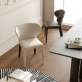 Stylish Beige And Black Dining Chairs With Wooden Floor Table Books And Bright Window Light