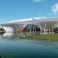Modern Architectural Structure With Large Canopy Roof Over Water And Green Lawn