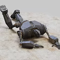 Damaged Intelligent Machine Lying on Sandy Ground With Broken Mechanical Parts and Metallic Body