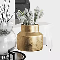 Elegant Golden Ceramic Vase with White Flowers and Textured Surface