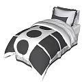 Single Bed With Black And White Bedding Featuring Circular Patterns And Pillows