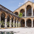 Historic Arched Courtyard Garden With Central Fountain Palm Trees And Reflecting Pool