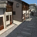 Traditional Chinese Commercial Street With Stone Paved Paths White Walls And Wooden Windows