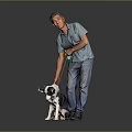 Cute black and white puppy being walked with yellow leash by man in gray background