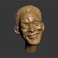 Golden Human Head Sculpture Showcasing Detailed Facial Features And Shiny Surface