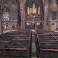 European Architecture Church Interior With Wooden Benches Pipe Organ And Stained Glass Windows