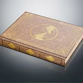 Vintage Hardcover Book with Brown Cover Gold Decorations Circular Emblem and Elegant Design