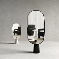 Large And Small Oval Mirrors With Black White Bases Gray Wall Reflecting Black Chairs Tables