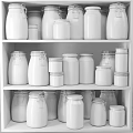 Various Grains Nuts and Spices in Glass Jars Neatly Arranged on White Kitchen Shelves