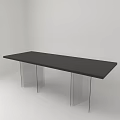Black Office Desk With Transparent Legs In Minimalist White Room Interior