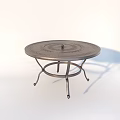 Outdoor Metal Circular Table With Decorative Pattern And Ornate Iron Base For Garden Patio Use