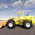 Yellow Heavy Duty Loader on Gray Sand Ground Under Blue Sky With White Clouds