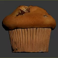 Golden Fluffy Muffin With Chocolate Chips In Paper Liner On Dark Background