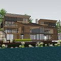 Modern Waterfront Wooden Villa Featuring Large Glass Windows Elevated Deck And Palm Trees