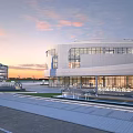 Modern Commercial Square Landscape With Glass Curtain Wall Building Fountains And Sunset Sky