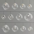 Modern Transparent Glass Globe Pendant Lights with Exposed Bulbs Various Sizes Hanging on Gray Background