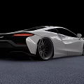 White Sports Car With Sleek Aerodynamic Body And Large Alloy Wheels