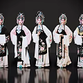 Women In Traditional Chinese Opera Costumes With Elaborate Embroidery And Ornate Headdresses Against Black Background
