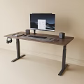 Standing Desk with Dark Wooden Top Metal Frame Monitor Speakers Headphones and Keyboard