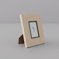 Light Wood Photo Frame With Stand Holding Small Photo Inside