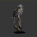 Realistic Owl Sculpture Perched on Wooden Branch with Black Base and Detailed Feather Texture