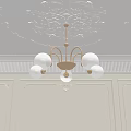 Elegant Golden Chandelier With White Spherical Bulbs And Intricate Ceiling Carvings
