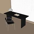 Modern Black Desk With Open Book Table Lamp And Black Metal Chair By Window