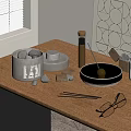 Decorative Ornament Set With Black Stones Gray Cylindrical Box And Silver Ball On Wooden Tabletop