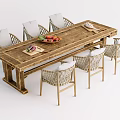 Rustic Long Wooden Table and Woven Chair Set with Fruits and Bread