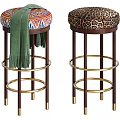 Colorful Patterned Leopard Print Bar Stools With Green Scarf Dark Wooden Legs Gold Rings