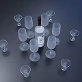Transparent Wine Glasses Arranged Around White Label Bottle On Dark Background