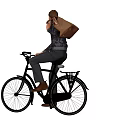 A Man Sitting On Bicycle With Brown Backpack And Casual Attire