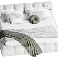 Comfortable Double Bed With Upholstered Headboard Plaid Pillows Round Cushion And Green Blanket