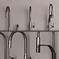 Stylish Metal Faucet Collection With Various Spout And Handle Designs On Exhibition Shelf